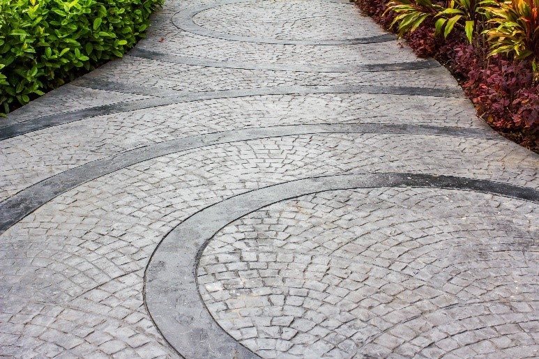 Patterns made in a path of a garden using slate