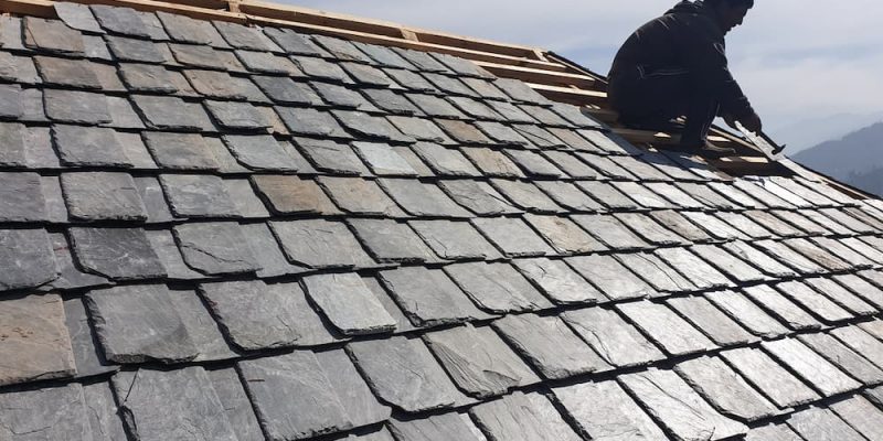 slate roof tiles being laid